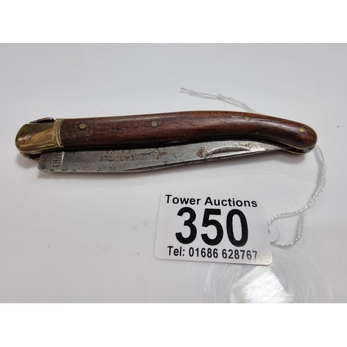 350 - A good quality vintage laguiole folding knife with a wooden handle. Made in France, with a trademark... 