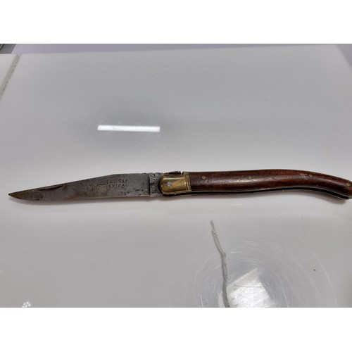350 - A good quality vintage laguiole folding knife with a wooden handle. Made in France, with a trademark... 