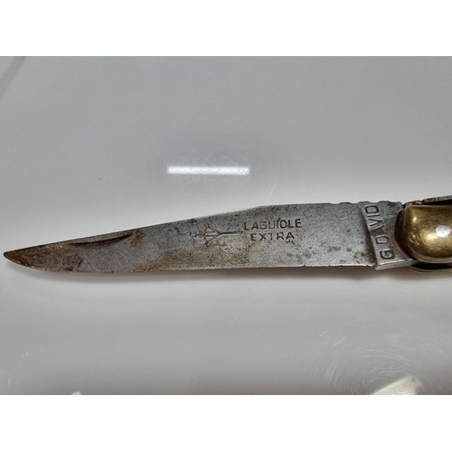 350 - A good quality vintage laguiole folding knife with a wooden handle. Made in France, with a trademark... 