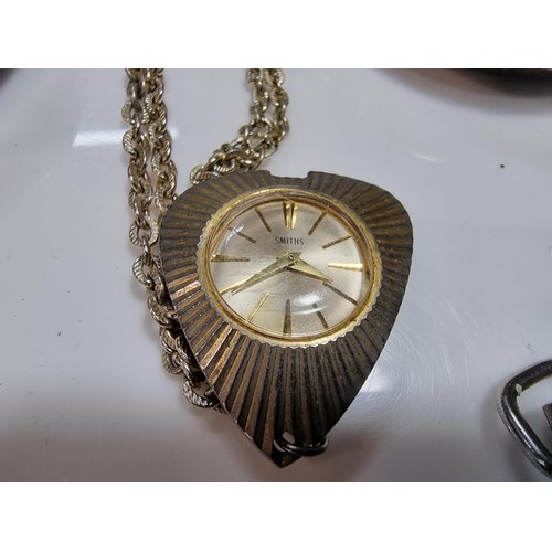352 - 2 x pocket watches. A smiths and a Ingersoll along with a smith pendant watch and 3 pocket watch cas... 
