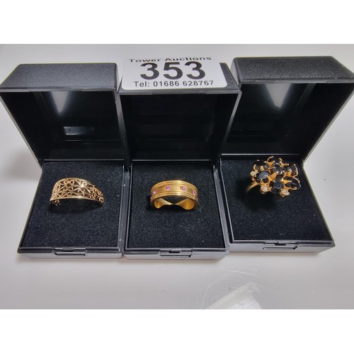 353 - 3 x boxed attractive dress rings including a ring with pink gems all the way around a pierced ring a... 