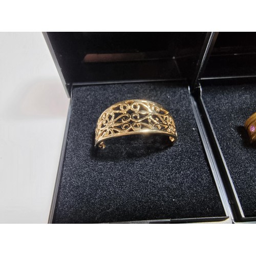 353 - 3 x boxed attractive dress rings including a ring with pink gems all the way around a pierced ring a... 