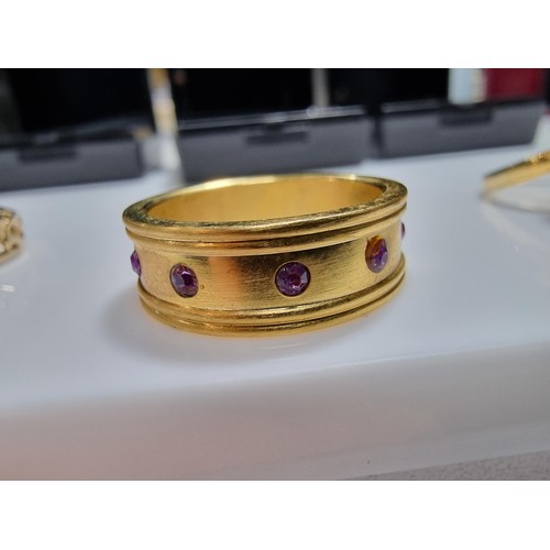 353 - 3 x boxed attractive dress rings including a ring with pink gems all the way around a pierced ring a... 