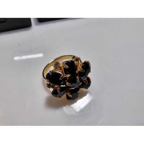 353 - 3 x boxed attractive dress rings including a ring with pink gems all the way around a pierced ring a... 