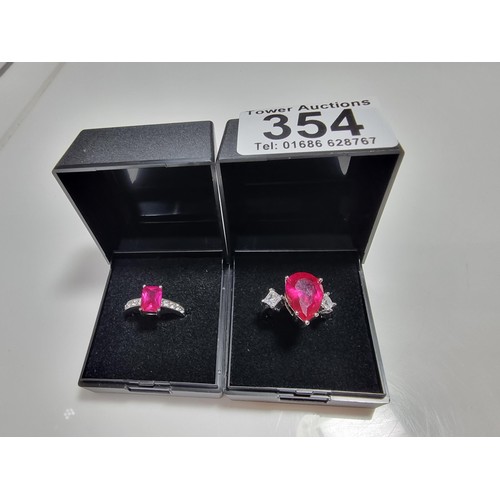 354 - 2 x pretty dress rings, both 18 ct gold plated.
Both rings are inset with a large pink sapphire ston... 