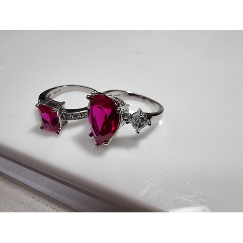 354 - 2 x pretty dress rings, both 18 ct gold plated.
Both rings are inset with a large pink sapphire ston... 