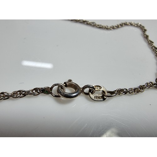 355 - A 925 silver pendant inset with a large faceted heart formed smokey quartz gemstone. Set on a 16