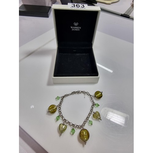 363 - A 925 silver charm bracelet with various art glass charms, boxed in excellent condition (marked 925)... 