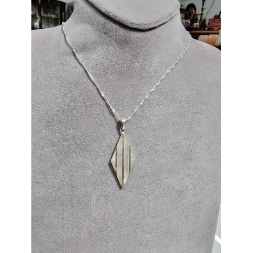 365 - A 925 silver and mother of pearl pendant with an attractive design. Set on a long 24