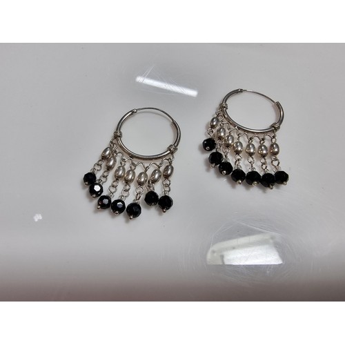 366 - A pair of ornate hooped earrings with tassel beaded drops.
In good clean condition, marked 925.
Leng... 