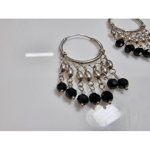 366 - A pair of ornate hooped earrings with tassel beaded drops.
In good clean condition, marked 925.
Leng... 