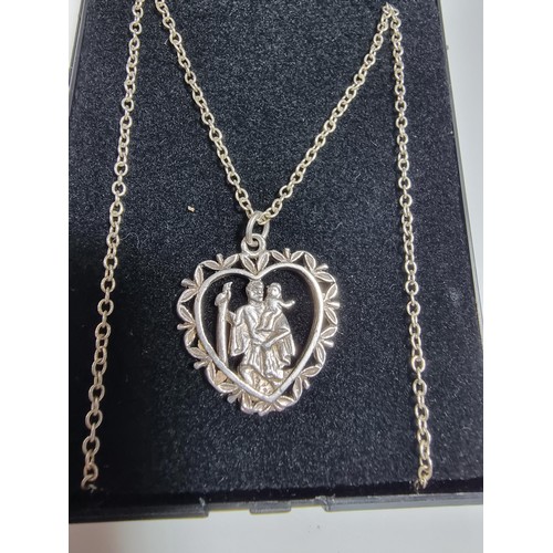 367 - A 925 silver part formed St Christopher pendant. Set on a 20