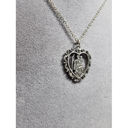 367 - A 925 silver part formed St Christopher pendant. Set on a 20