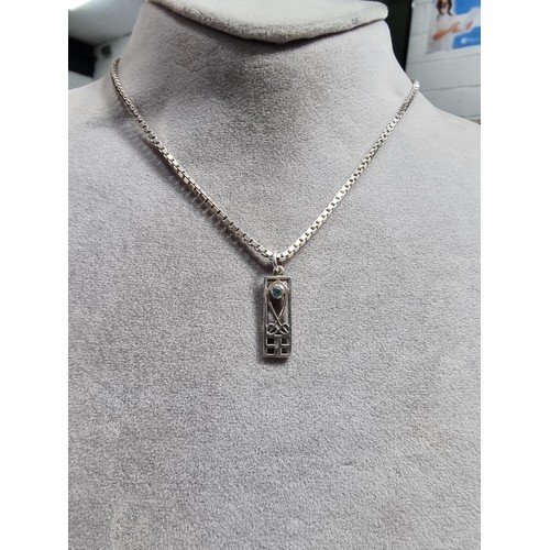 370 - A matching 925 silver jewellery set Rennie Macintosh design. Pendant is inset with a blue stone on a... 