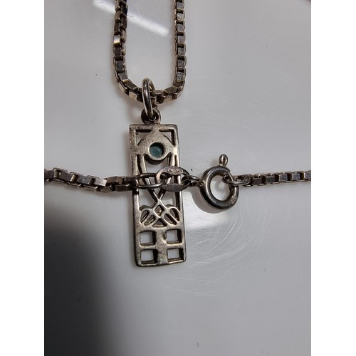 370 - A matching 925 silver jewellery set Rennie Macintosh design. Pendant is inset with a blue stone on a... 