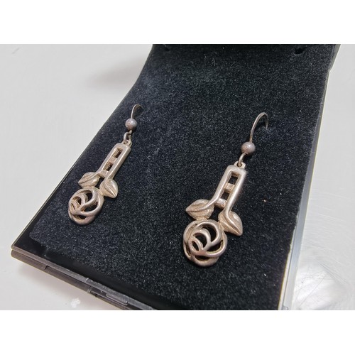 370 - A matching 925 silver jewellery set Rennie Macintosh design. Pendant is inset with a blue stone on a... 