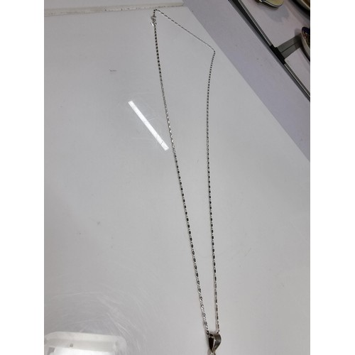 374 - A large 925 silver m.o.p. pendant with an unusual natural design, set on a very long 26