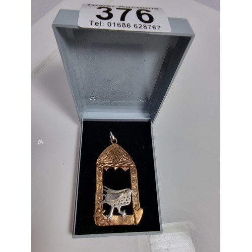 376 - An unusual vintage arts & crafts copper and pewter large pendant of a bird in an archway scene. Engr... 