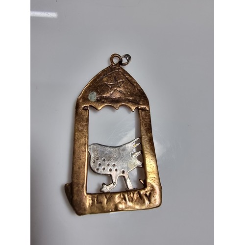 376 - An unusual vintage arts & crafts copper and pewter large pendant of a bird in an archway scene. Engr... 