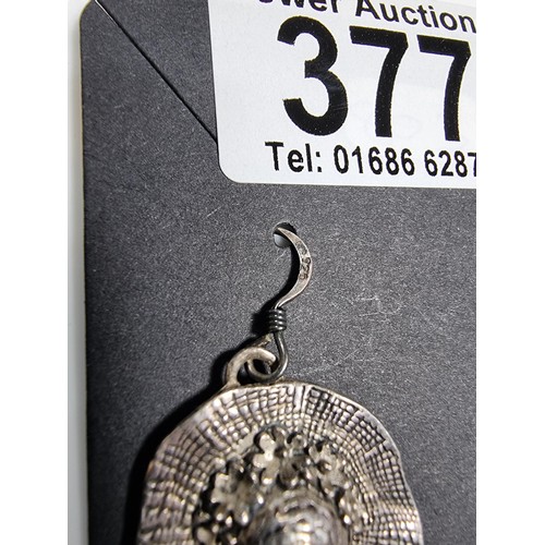 377 - A pair of 925 silver hat formed drop earrings, along with a silver plated sunflower pendant.