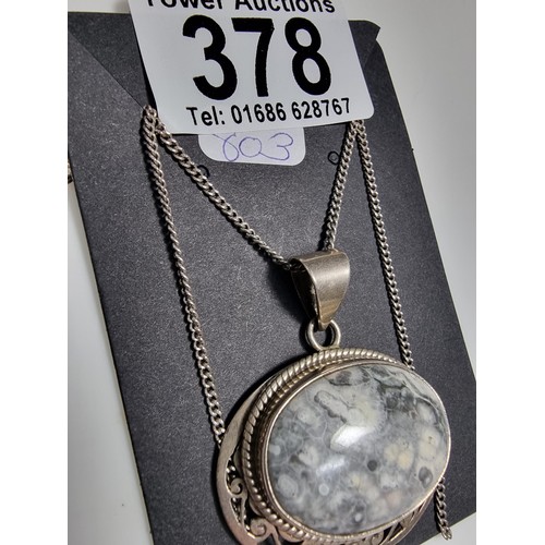 378 - A 925 large silver pendant inset with a large oval ocean jasper gemstone with an interest in natural... 