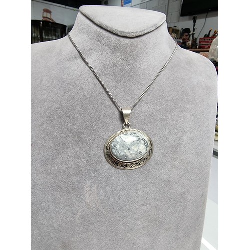 378 - A 925 large silver pendant inset with a large oval ocean jasper gemstone with an interest in natural... 