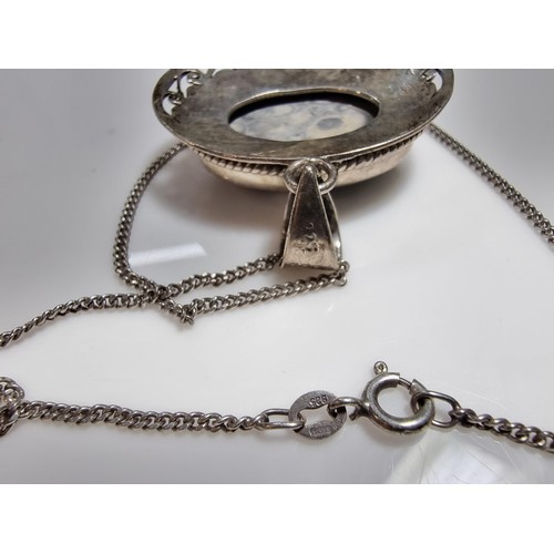 378 - A 925 large silver pendant inset with a large oval ocean jasper gemstone with an interest in natural... 