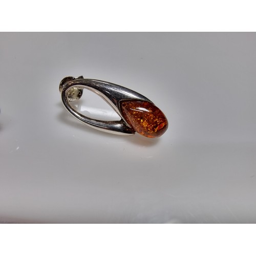 380 - A pair of 925 silver earrings inset with genuine Baltic amber stones marked 925. Boxed, in clean con... 