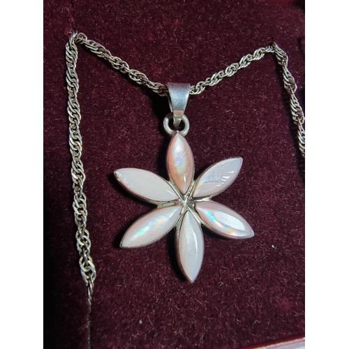 381 - A 925 silver jewellery set including a mother of pearl pendant on an 18