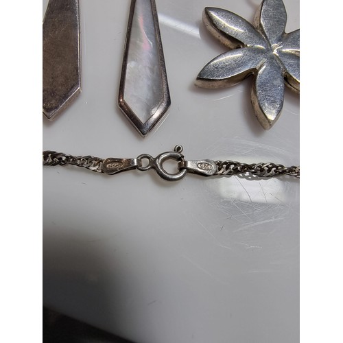 381 - A 925 silver jewellery set including a mother of pearl pendant on an 18