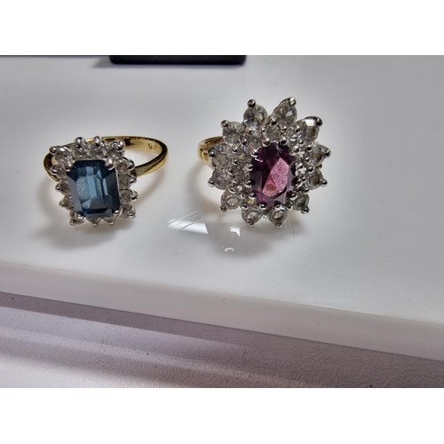 382 - 2 x Ornate costume gold plated dress rings, both are cluster style inset with purple, blue and clear... 