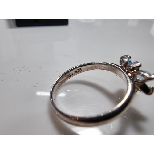 385 - A new old stock 925 silver dragonfly ring inset with blue stones.
size P, in a new quality ring box.
