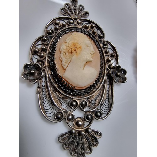387 - 3 vintage cameo's including a tested as silver pendant, a silver brooch marked 900 silver and one ot... 