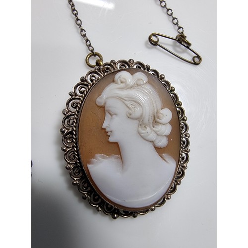 387 - 3 vintage cameo's including a tested as silver pendant, a silver brooch marked 900 silver and one ot... 