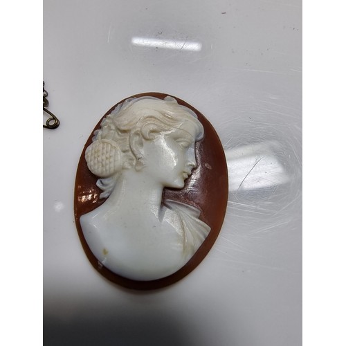 387 - 3 vintage cameo's including a tested as silver pendant, a silver brooch marked 900 silver and one ot... 