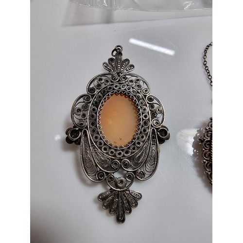 387 - 3 vintage cameo's including a tested as silver pendant, a silver brooch marked 900 silver and one ot... 