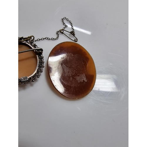387 - 3 vintage cameo's including a tested as silver pendant, a silver brooch marked 900 silver and one ot... 