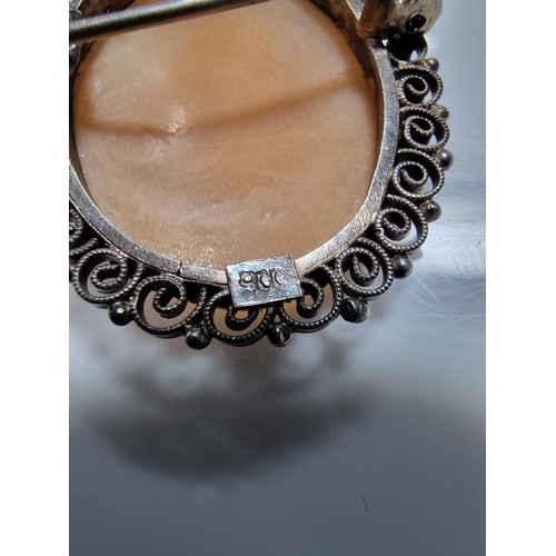 387 - 3 vintage cameo's including a tested as silver pendant, a silver brooch marked 900 silver and one ot... 