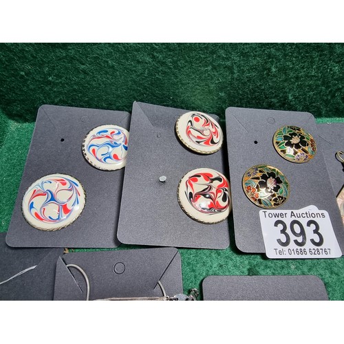 393 - A suite of various costume jewellery including enamelled earrings and ornate fob watch, matching jew... 