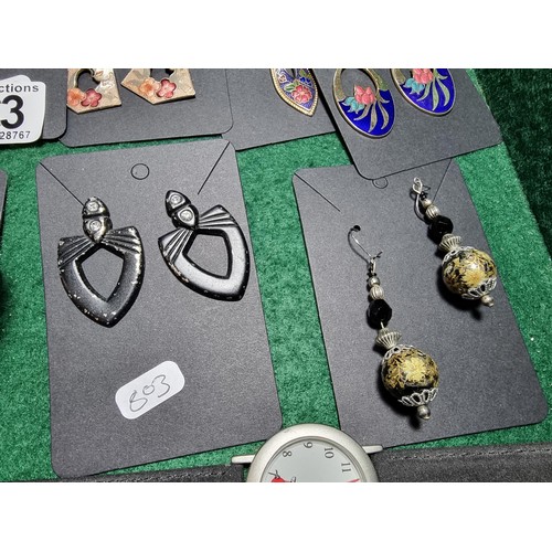 393 - A suite of various costume jewellery including enamelled earrings and ornate fob watch, matching jew... 