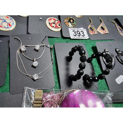 393 - A suite of various costume jewellery including enamelled earrings and ornate fob watch, matching jew... 