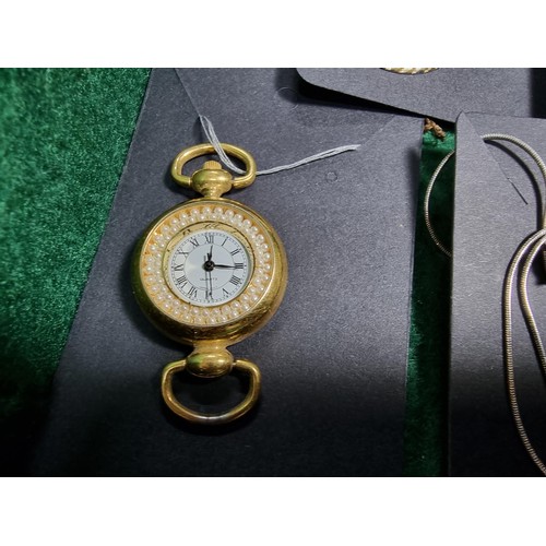 393 - A suite of various costume jewellery including enamelled earrings and ornate fob watch, matching jew... 
