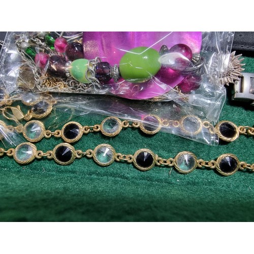 393 - A suite of various costume jewellery including enamelled earrings and ornate fob watch, matching jew... 
