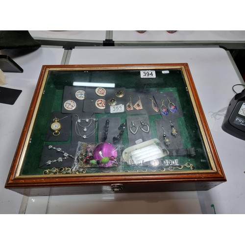 394 - A vintage wooden tabletop display case with a  glazed top in excellent condition, jewellery inside i... 