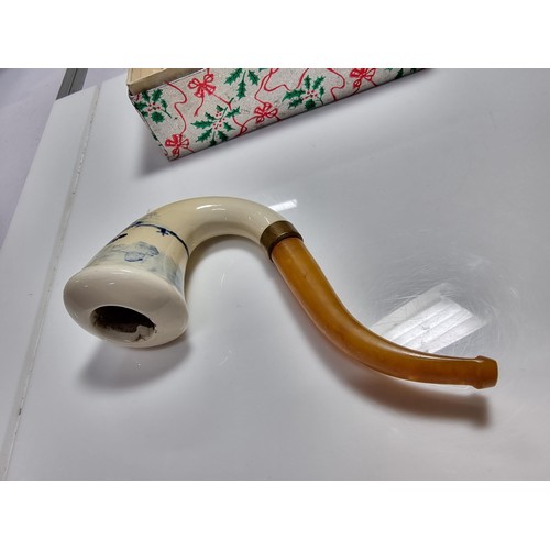 398 - A good quality vintage ceramic delft pipe with a goods butterscotch amber stem.
Stem and pipe in goo... 