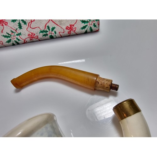 398 - A good quality vintage ceramic delft pipe with a goods butterscotch amber stem.
Stem and pipe in goo... 