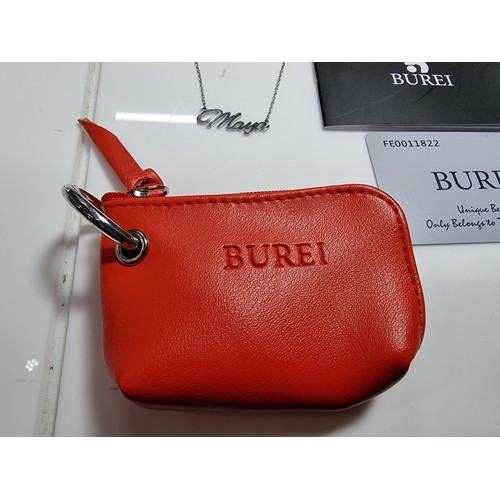399 - A boxed as new leather wallet and necklace with a maya pendant by Burei.