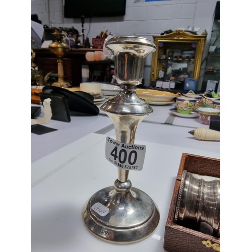 400 - A hallmarked silver candlestick along with a boxed hallmarked silver pair of serviette rings. Candle... 