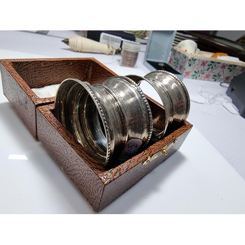 400 - A hallmarked silver candlestick along with a boxed hallmarked silver pair of serviette rings. Candle... 