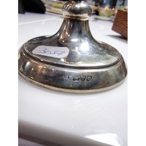 400 - A hallmarked silver candlestick along with a boxed hallmarked silver pair of serviette rings. Candle... 